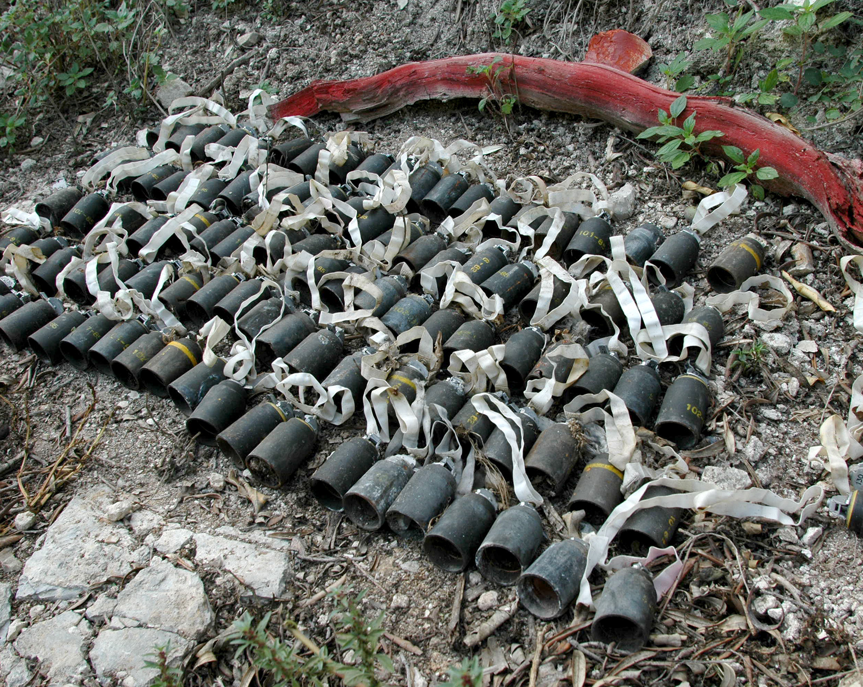 M85 cluster munitions gathered on the ground.